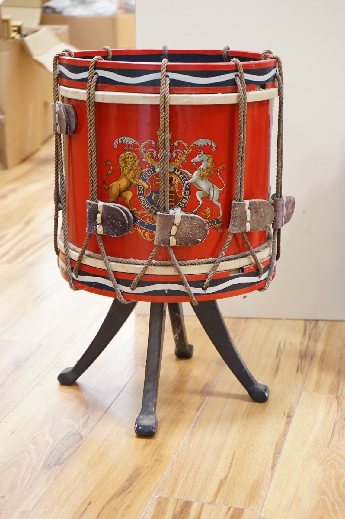 A red painted Regimental drum shaped table, 62cm high